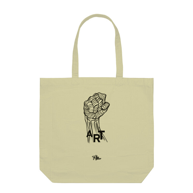 A beige cotton tote bag with a black handle and a black printed design of a fist and the word 'ART' on the front.