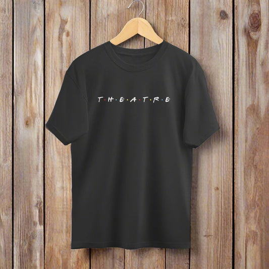 A white oversized t-shirt with the word 'THEATRE' printed in a line across the chest.