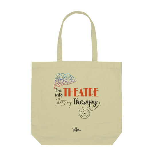 A beige tote bag with the text 'THEATRE THERAPY' printed on the front, featuring a stylized graphic of a brain and a therapy icon.