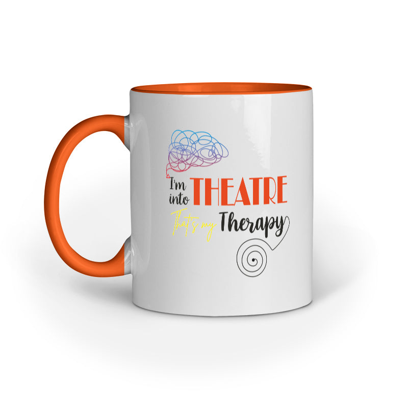 A white ceramic mug with black handle and interior, featuring text and graphics related to theatre therapy.